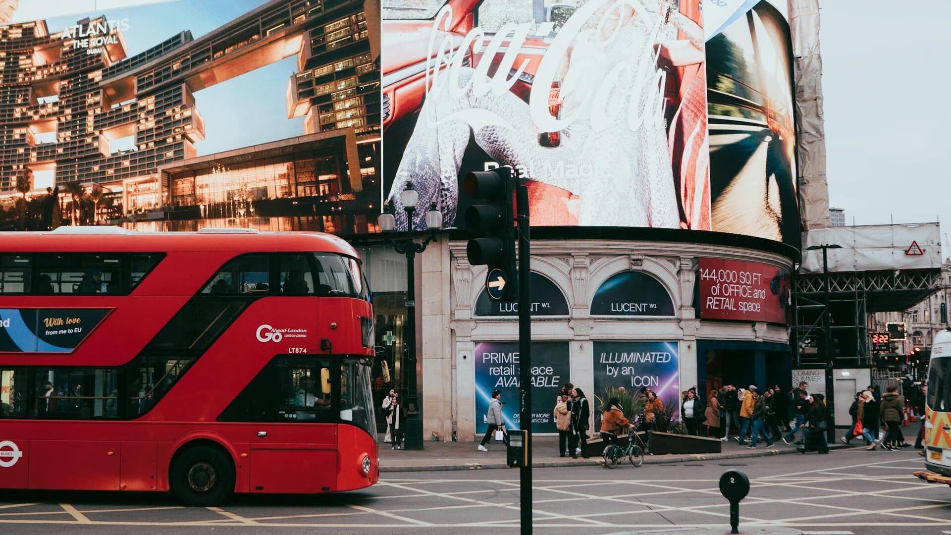 Large billboard advertisement on a busy UK high street