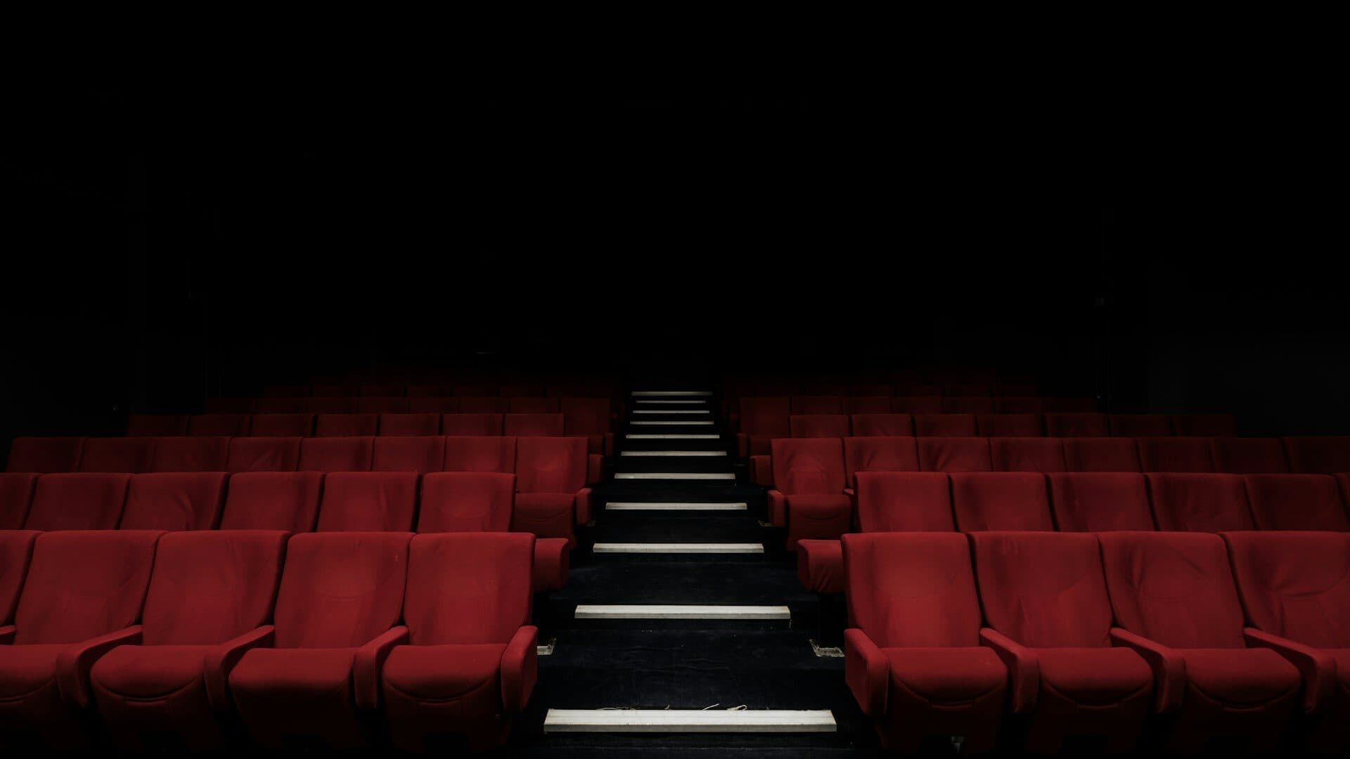 Cinema screen showing advertising to an audience before a film