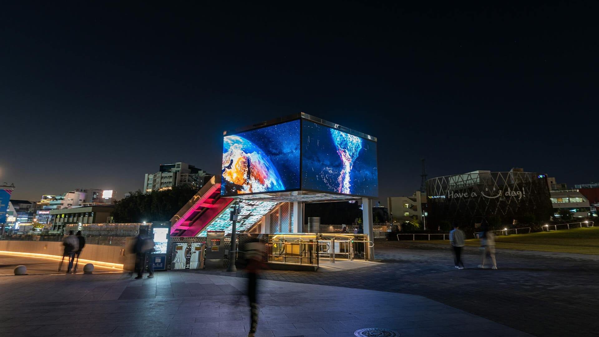 Digital LED billboard displaying vibrant advertising in a UK city