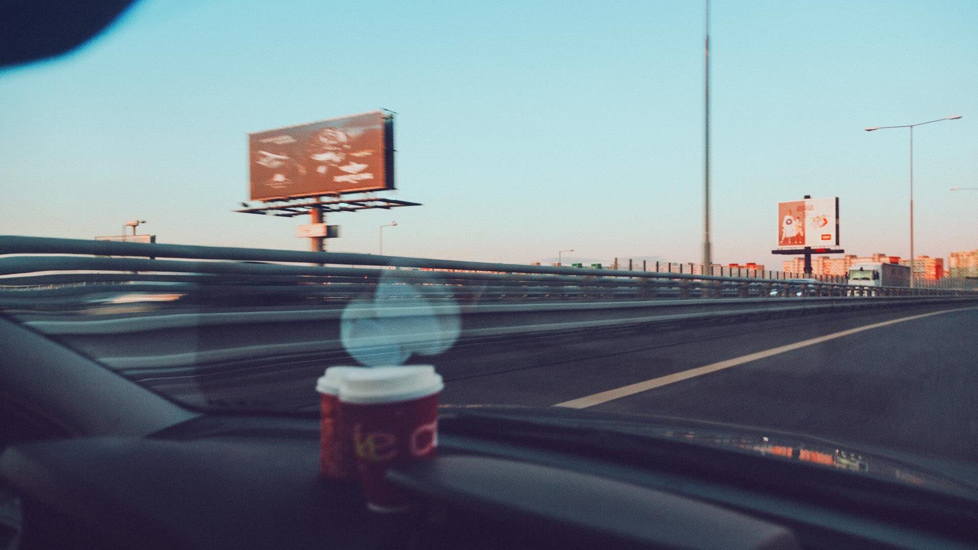 Large motorway billboard alongside a busy UK motorway