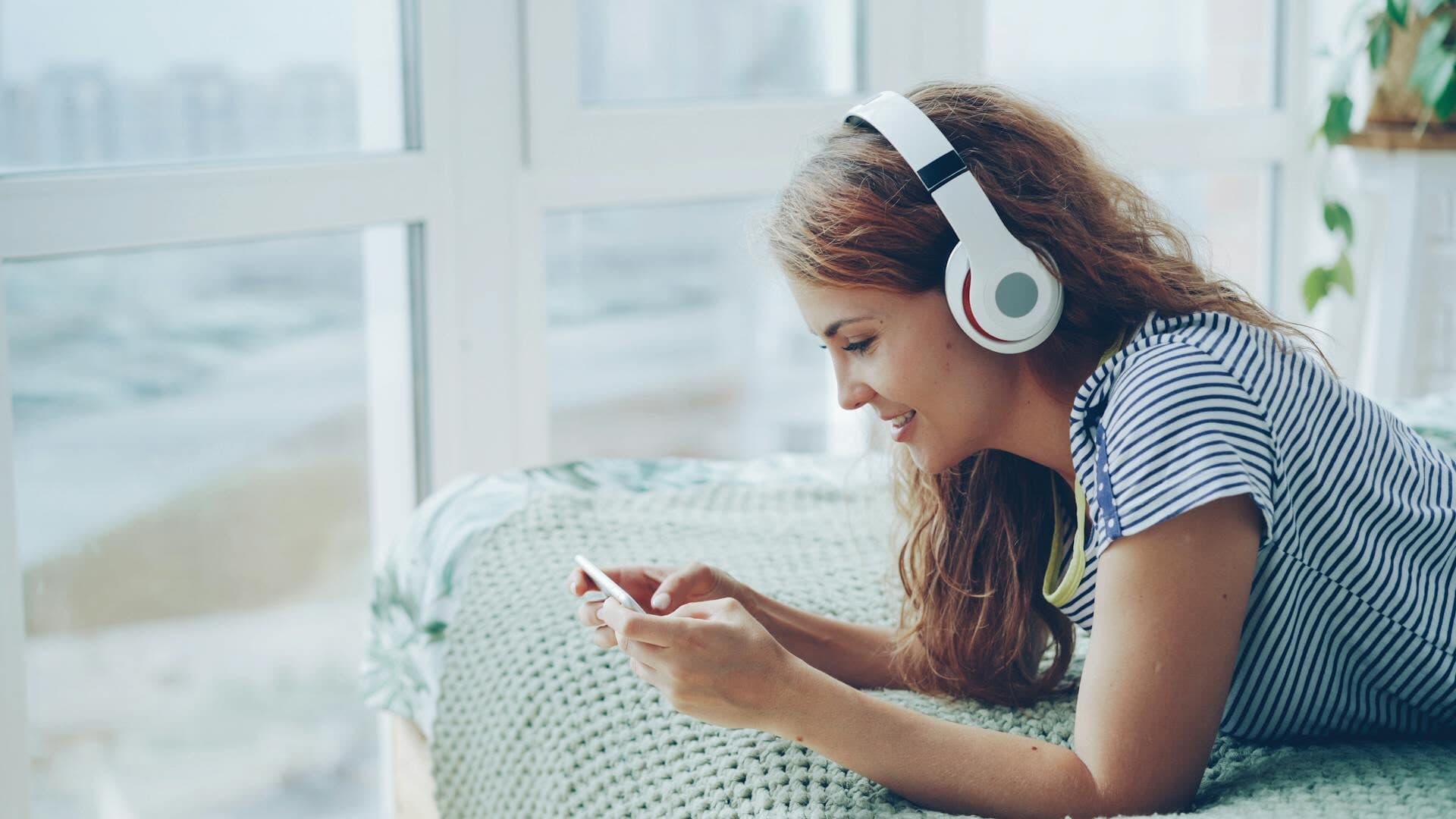 Spotify audio advertising campaign playing through headphones