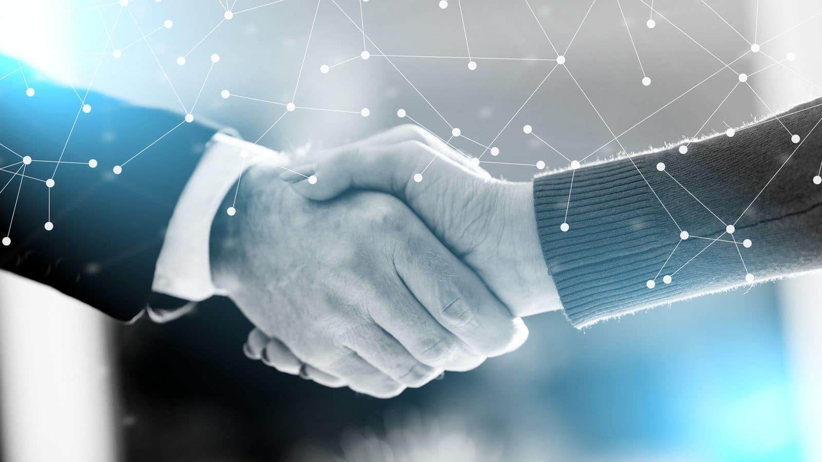 Two people in suits shaking hands, overlaid with a web of connected network lines