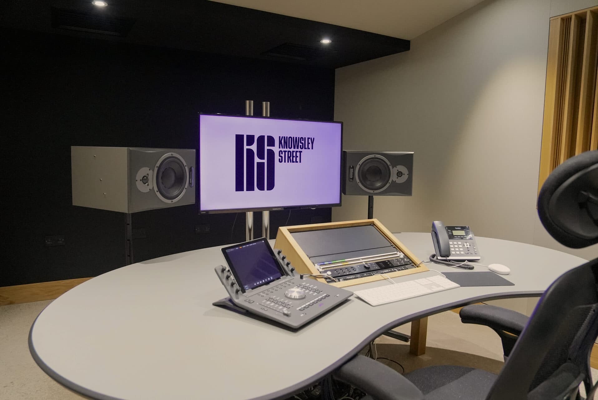 Client listening area with monitor speakers and production desk